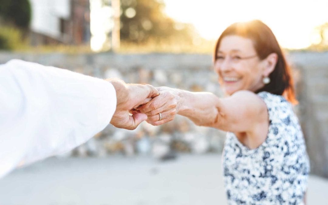 woman and man holding hands