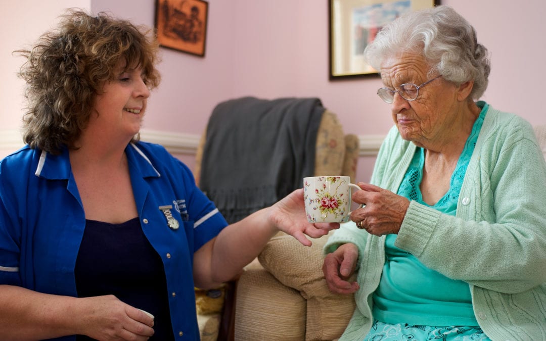 Elderly with a carer