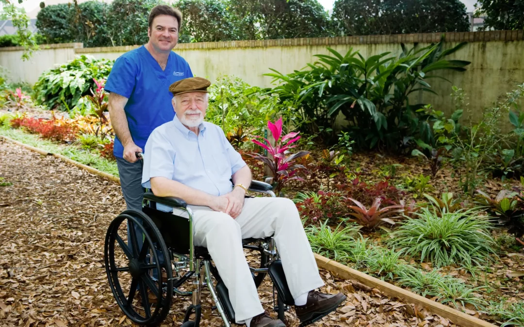 Elderly in the wheelchair with the caregiver